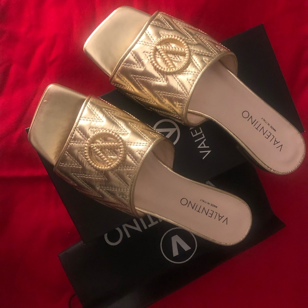 Beautiful, never worn Valentino gold sandals/slides.  Box and dust bag included!